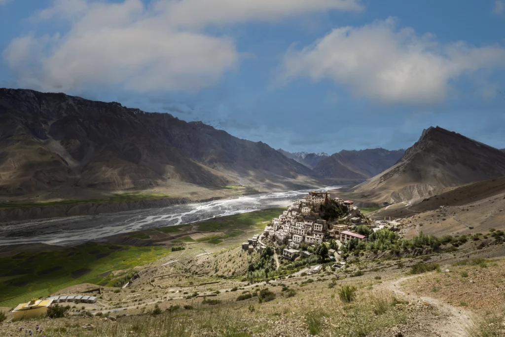 Key Monastery in Spiti Valley perched dramatically on a hilltop with prayer flags and Himalayan peaks