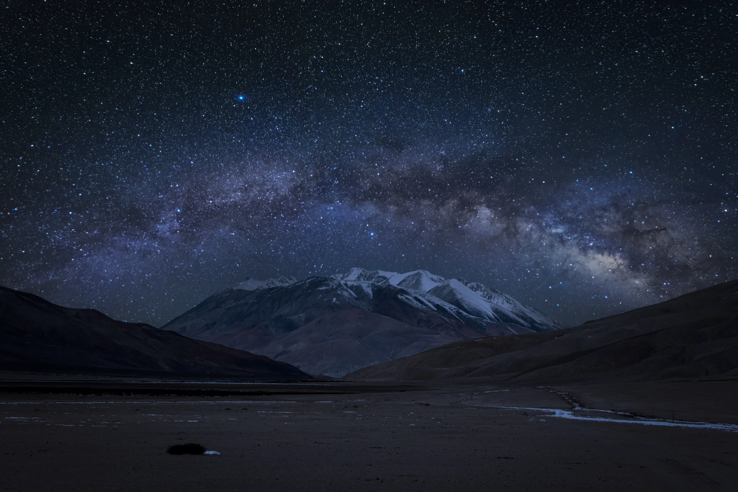 Milky Way core arching over dome shape mountain on the way to Hanle, one of India's most unique dark sky photography locations