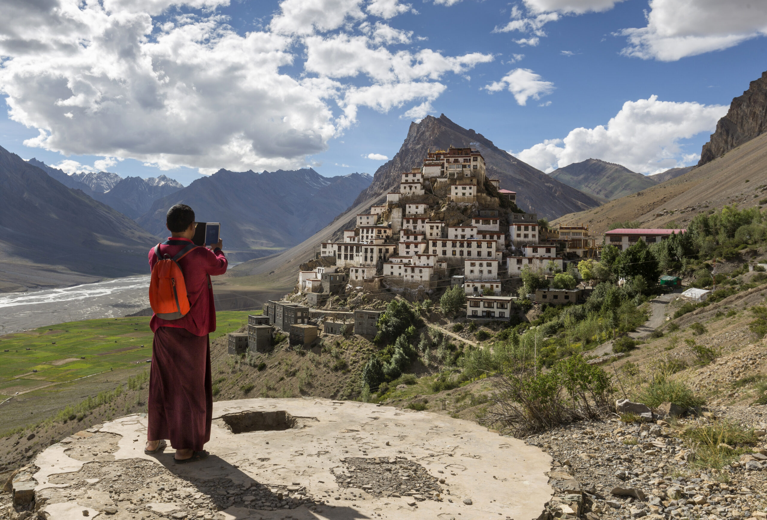 Key Monastery in Spiti Valley perched dramatically on a hilltop with prayer flags and Himalayan peaks